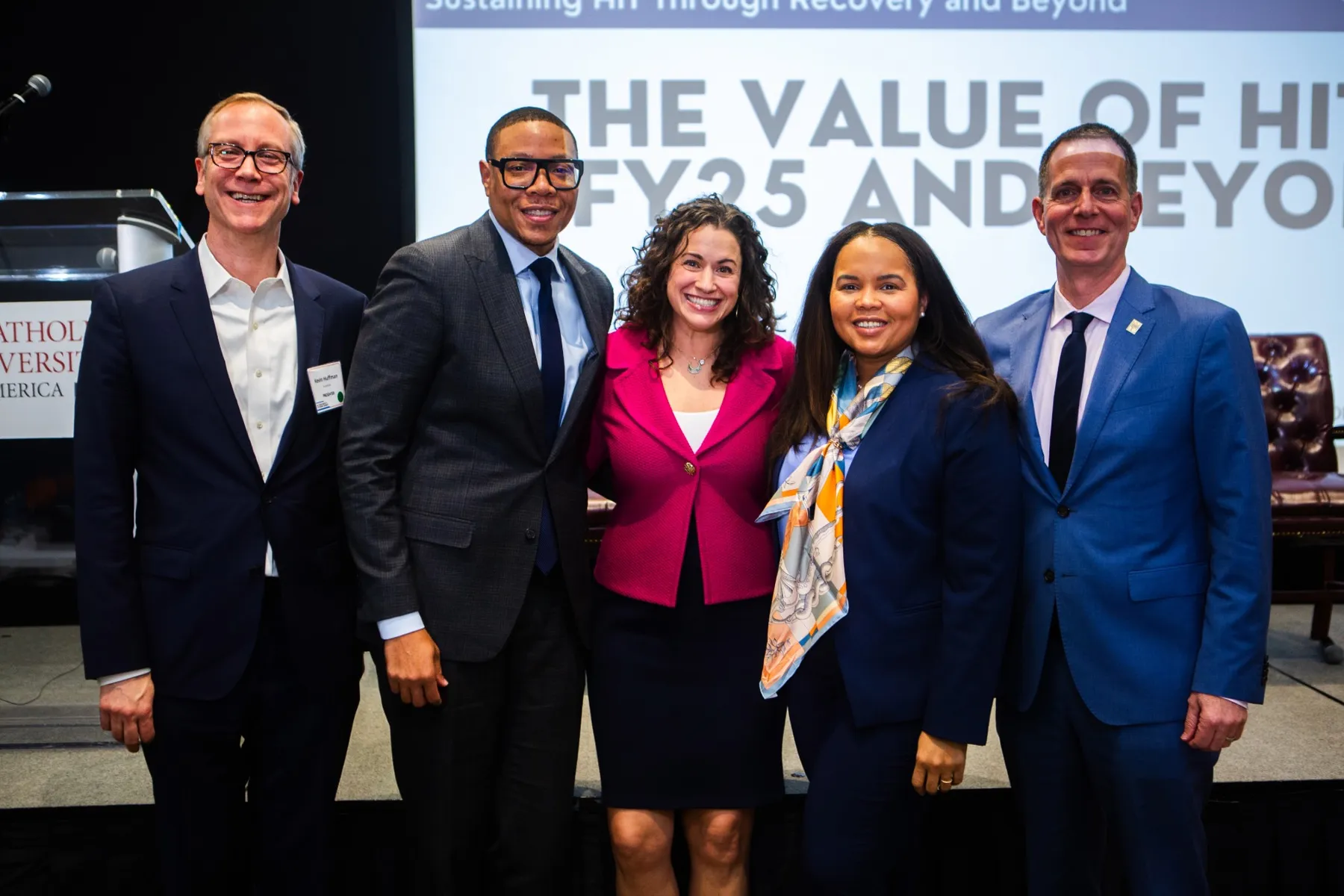 Five adults posing together at a tutoring summit