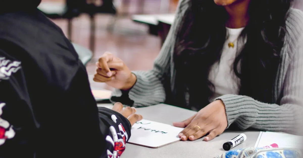 Close view of hands working with small cards and papers